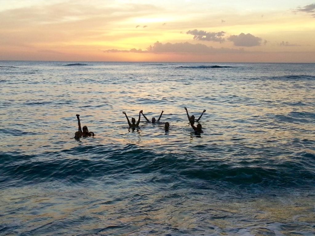 Group of people swimming in the ocean