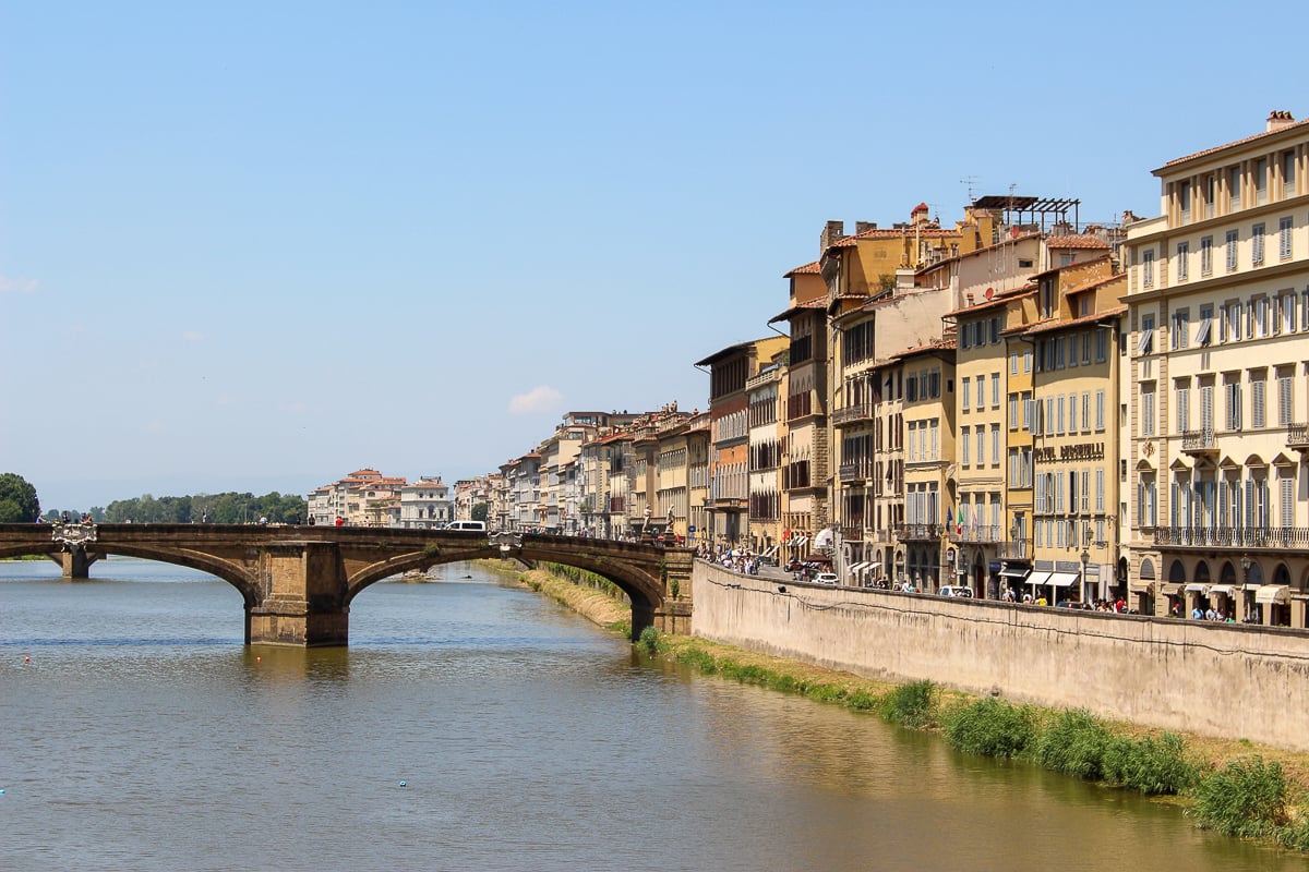 Medieval buildings and a bridge over the Arno River. During your 3 days in Florence, you can choose to explore the neighborhood of Oltrarno.