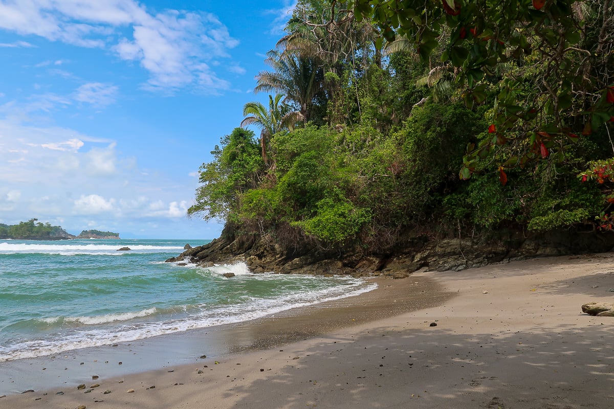 Wavy beach and lush greeneries in Manuel Antonio, Costa Rica
