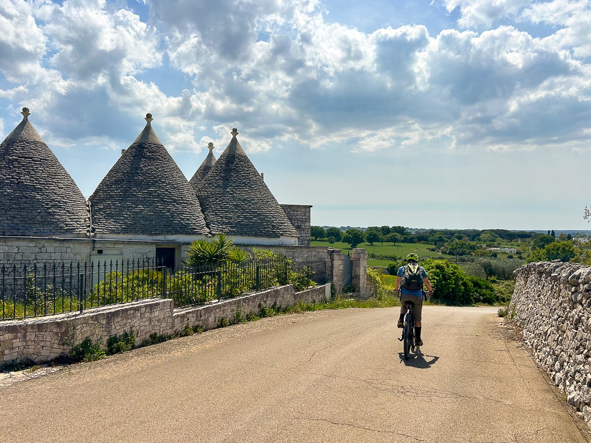 Biking along the roads of Alberobello, Puglia on a sunny day