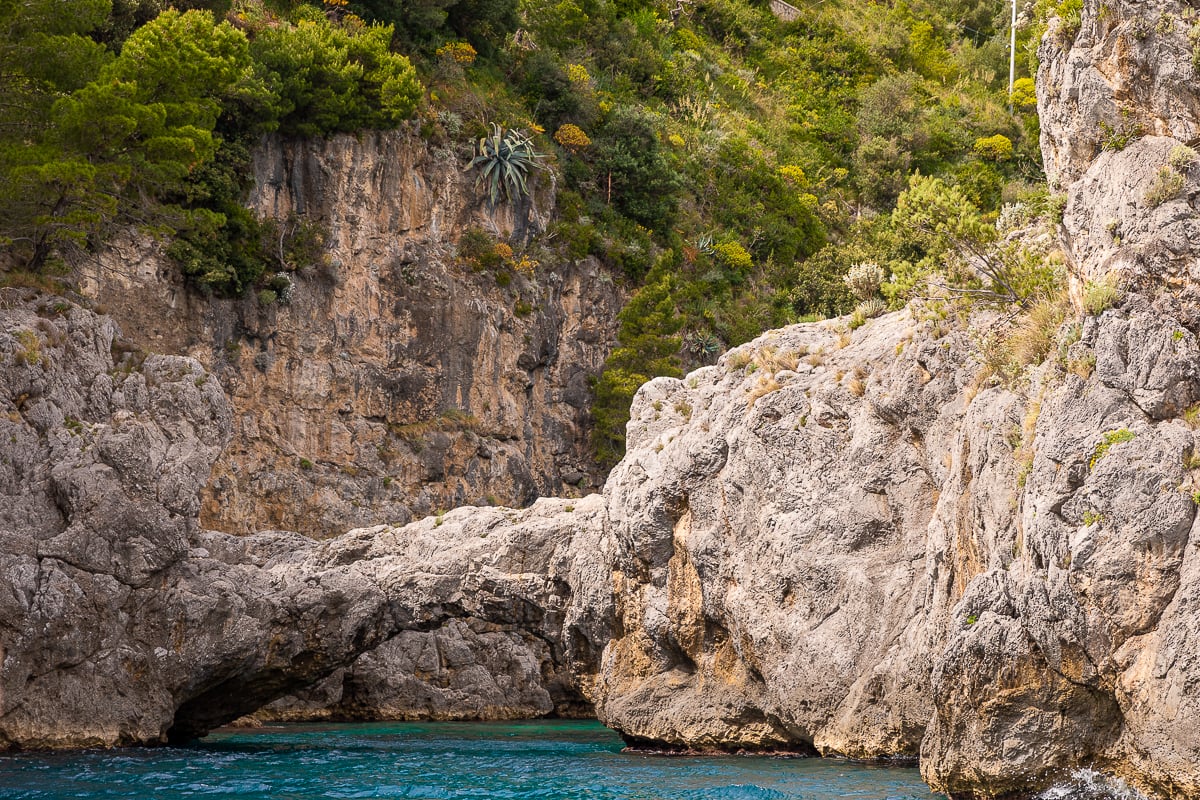 Peaceful view of the mountains during a boat tour. Exploring this magical place by boat is one of the activities to try in Amalfi Coast.