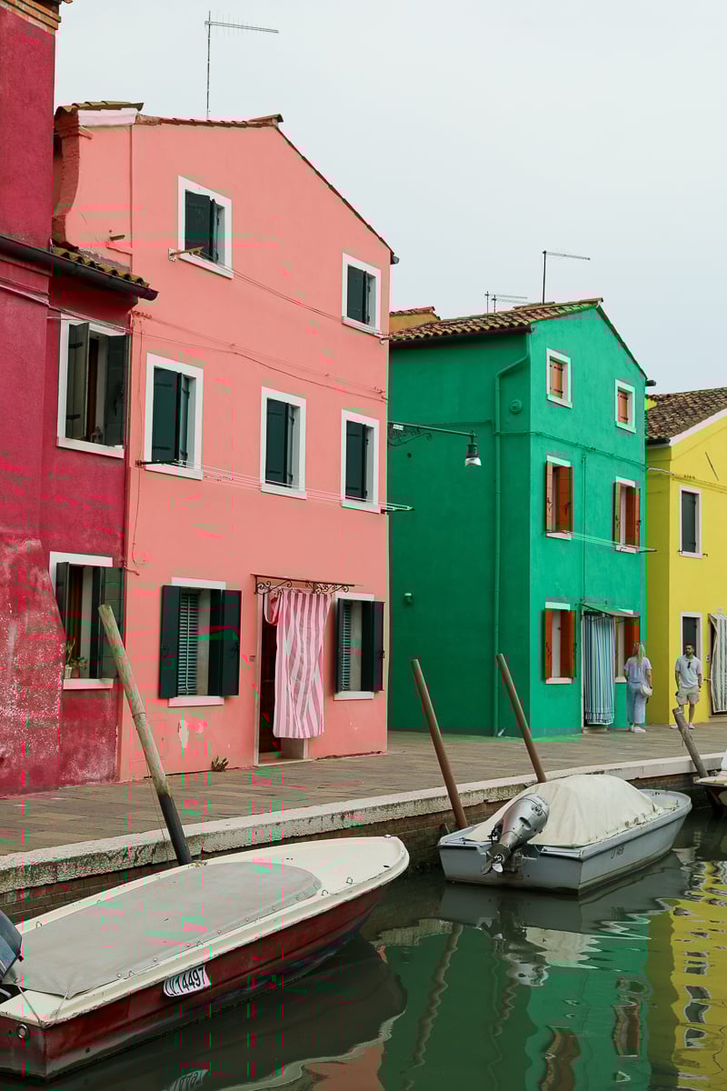 Colorful houses by a canal in Burano, Venice