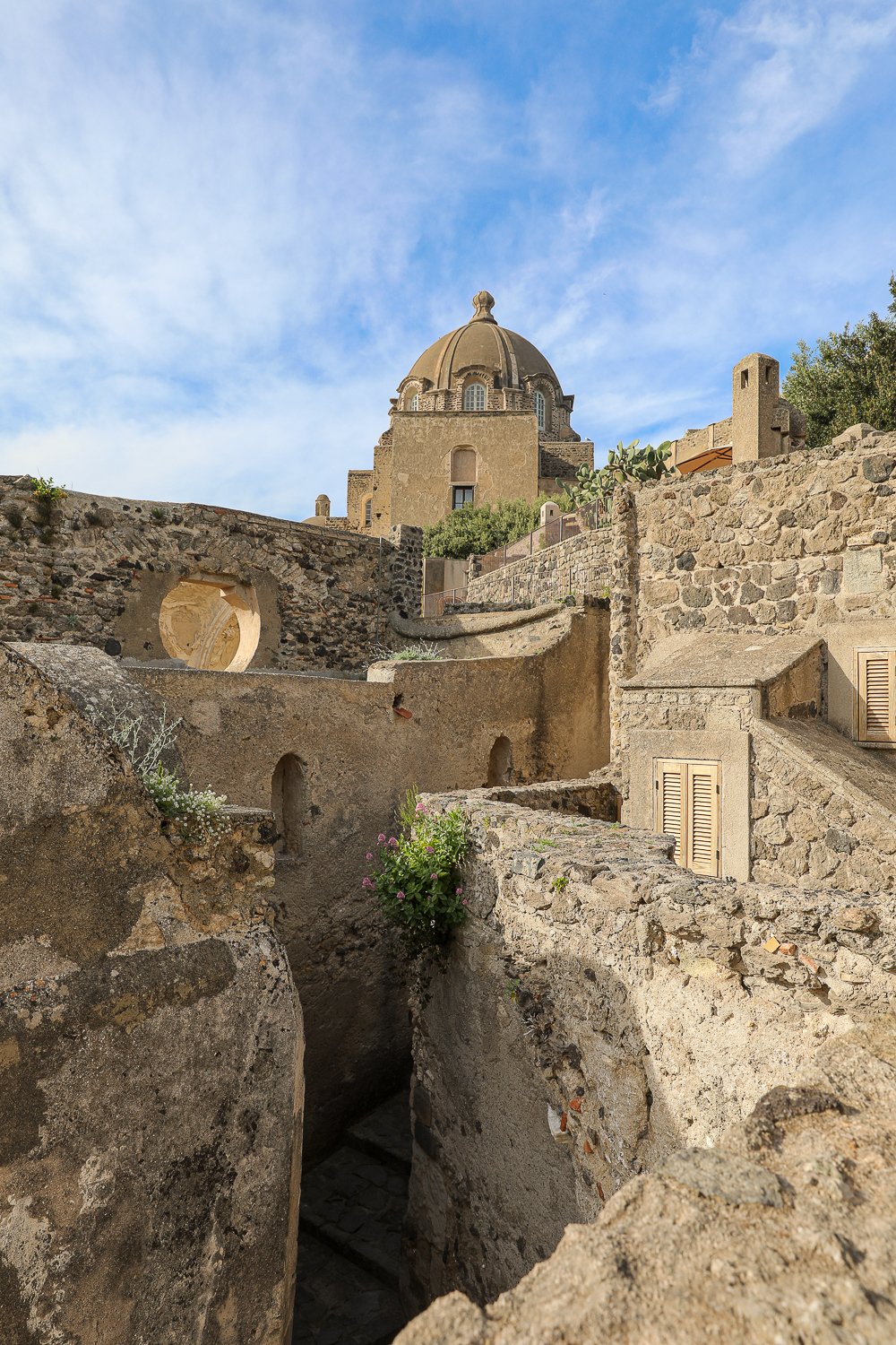 Beautiful stone walls of Castello Aragonese, one of the unmissable attractions in Ischia, Italy