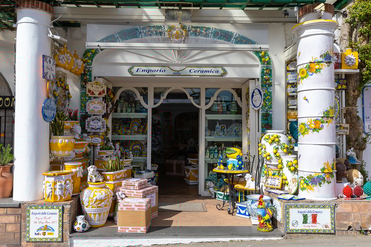 Colorful ceramics displayed at the facade of a ceramic shop in Positano