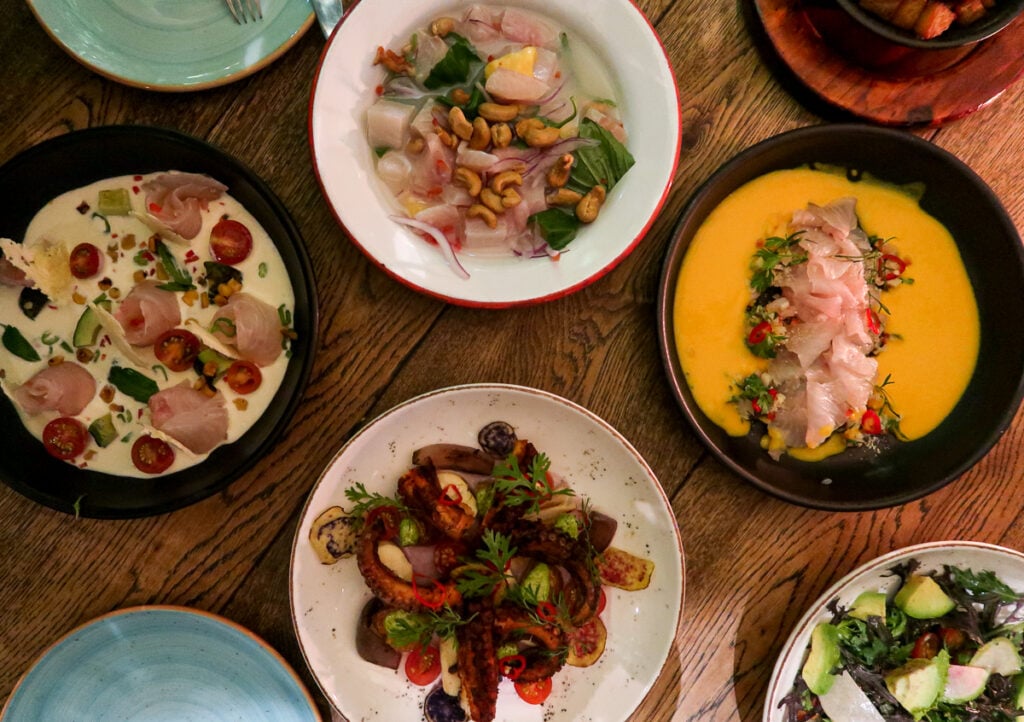 Table of delicious dishes at Central Cevicheria. Eating at this restaurant is one of the things to do in Bogota.