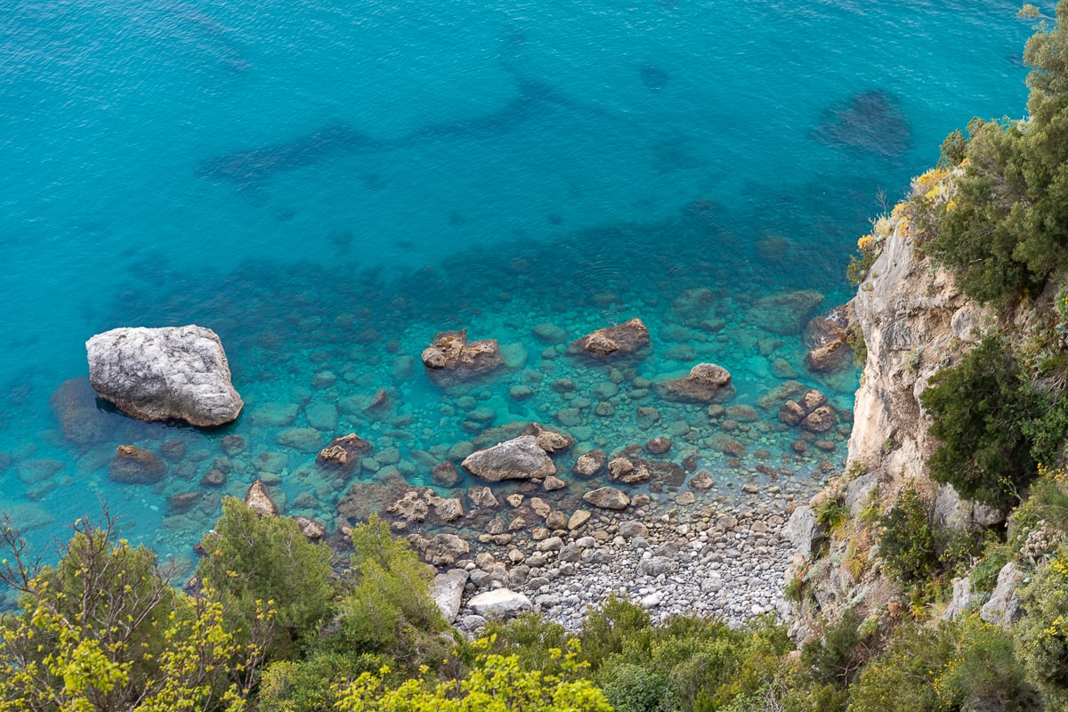 View of the cliff and turquoise sea waters of Amalfi Coast