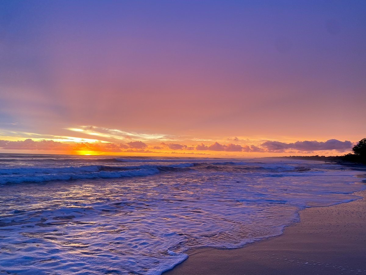 Pink and purple sunset hues in a beach in Costa Rica