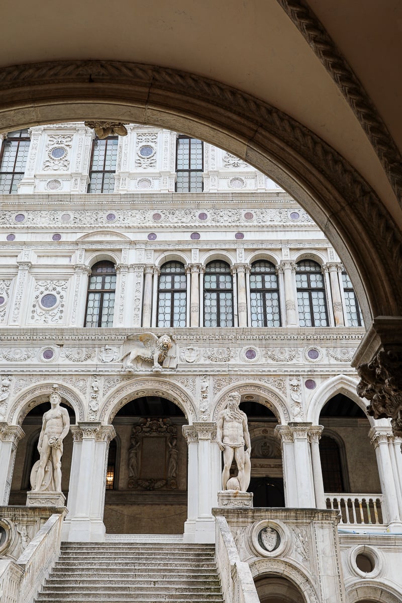 A view of the front of Doge's Palace from underneath an archway in the inner-courtyard - a tour of the Doge's Palace is an unmissable activity in any Venice itinerary