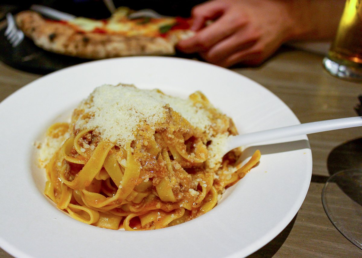 Delicious pasta topped with freshly shaven truffles at Mercato Centrale. Your Florence itinerary must include eating at Mercato Centrale and trying out delicious dishes that they offer.