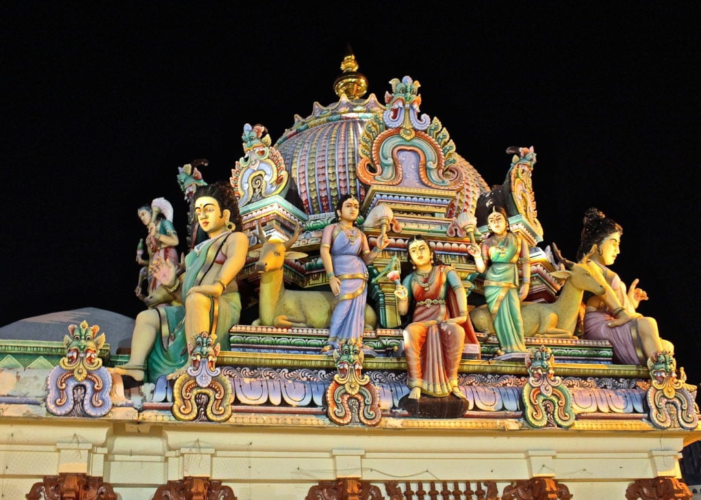 Historic Sri Mariamman Hindu Temple in Chinatown at night. This landmark is a must-visit during your 24-hour layover in Singapore.