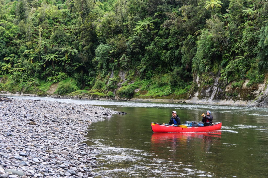 Visiting New Zealand and want to do something epic in the outdoors? Then consider the Whanganui River Journey! This three-day canoeing expedition is one of the most unique and adventurous things you might ever do. Here's what it's like to canoe down the Whanganui River. New Zealand Travel | North Island | Things to Do |