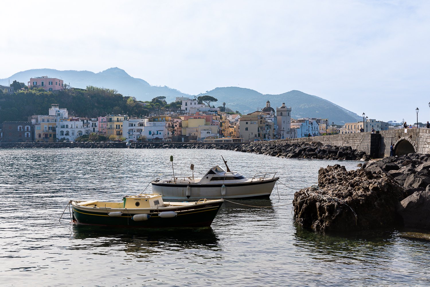 Boats docked in Ischia Ponte harbor during daytime