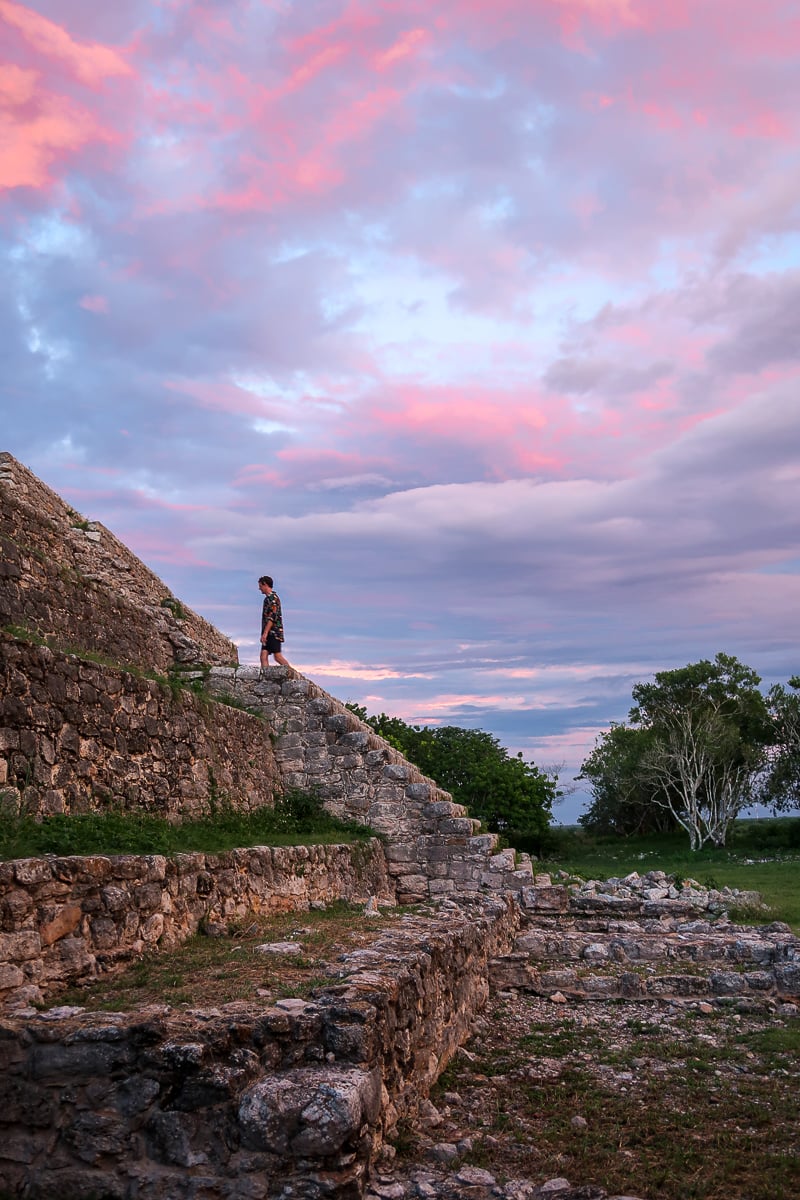 Climbing up a Maya pyramid during sunset - one of the best things to do in Valladolid, Mexico