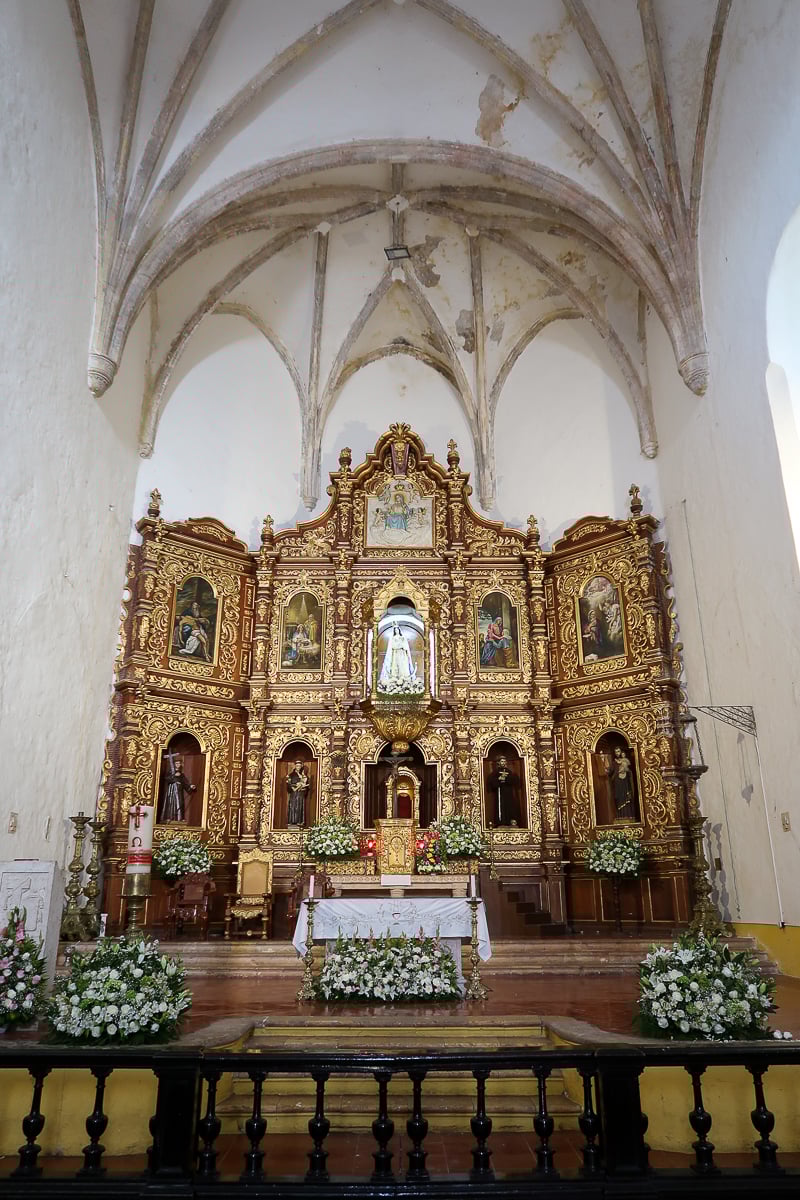 Baroque-style altarpiece inside the Convento de San Antonio de Padua featuring the statue of Our Lady of Izamal