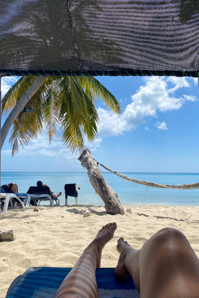 Relaxing on a cozy lounge chair on the white sand beach in Providencia, a charming Colombian island