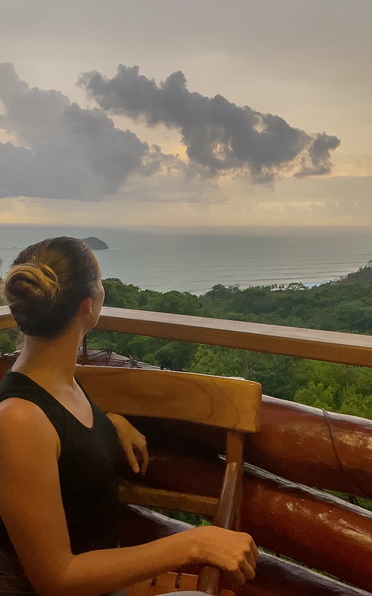 Maddy admiring the beautiful ocean views at El Avion. Dining at restaurants that offer these views is one of the things to do in Manuel Antonio.