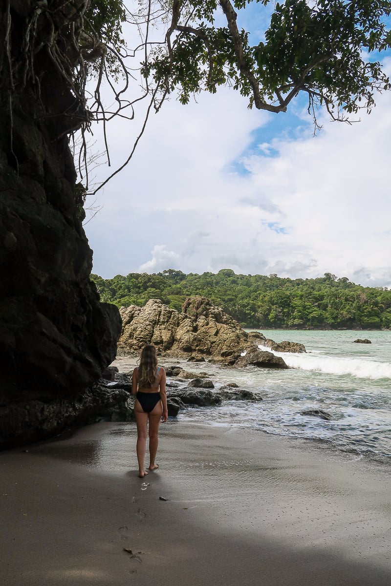 Maddy walking along the sandy beach of Manuel Antonio