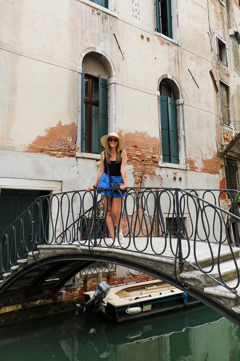 Maddy standing on a bridge in Venice