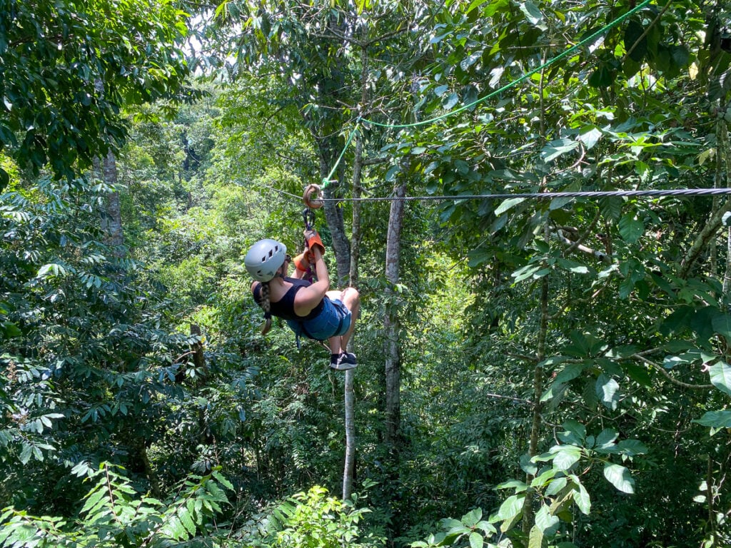 Maddy soaring on a zipline in Costa Rica—an exhilarating adventure, capturing the thrill of exploring the lush canopy from above