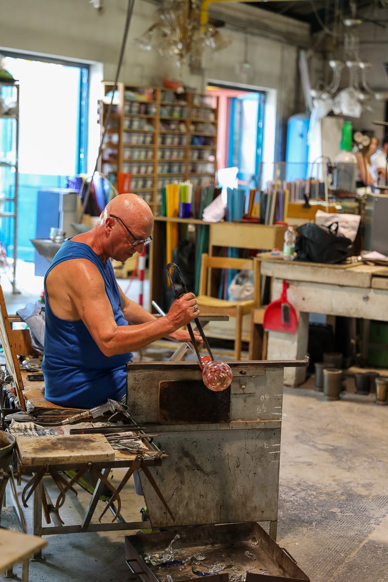 An old man blowing glass in Murano