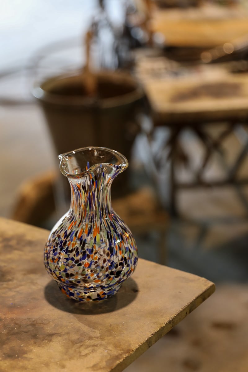 Colorful glass carafe made by the glassblower in Murano, Venice