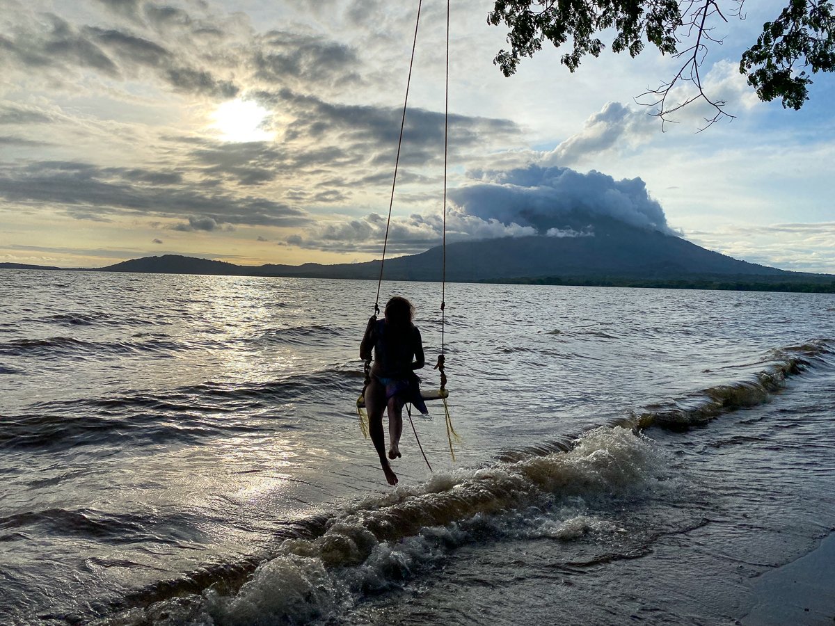 Melanie on a swing at sunset