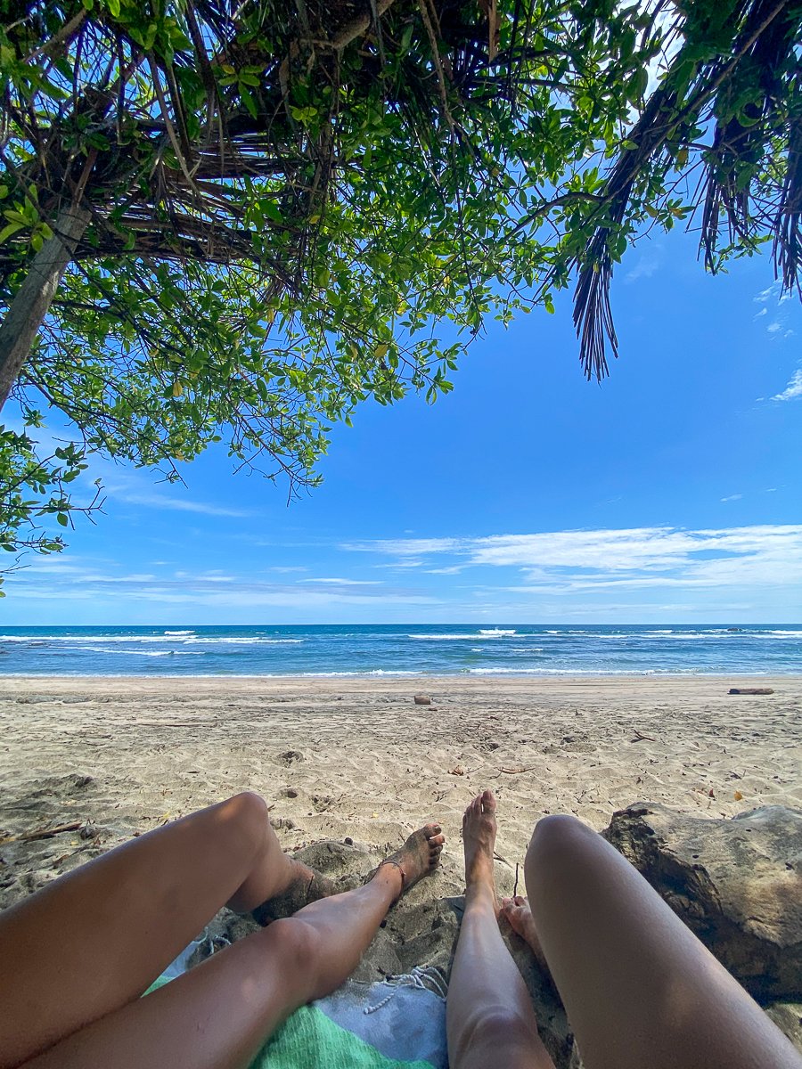 Hanging out under a tree shade on a beach. Going on a beach hop is a must-try for your Costa Rica adventure.