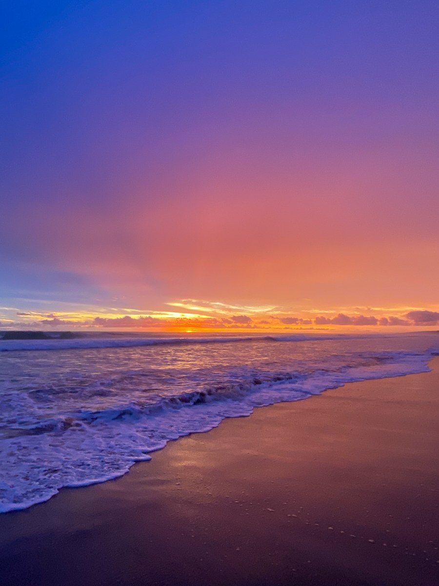Colorful sunset with blue-orange hues at Playa Avellanas