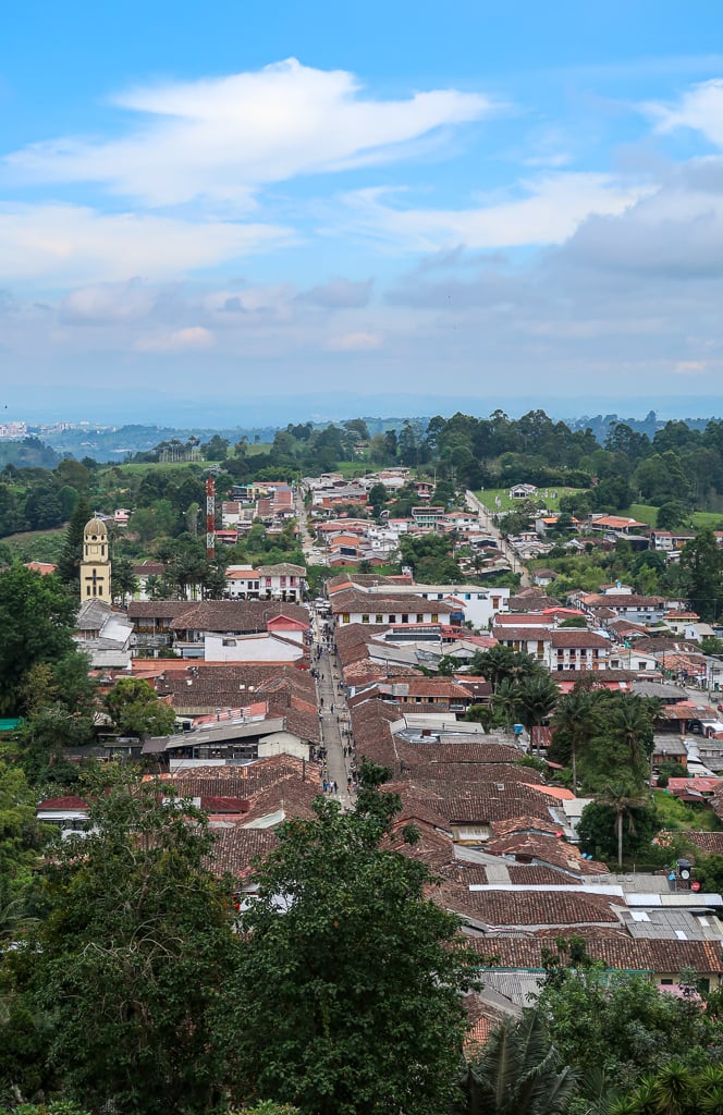 View of houses and buildings in Salento under blue skies as seen from the Miradores