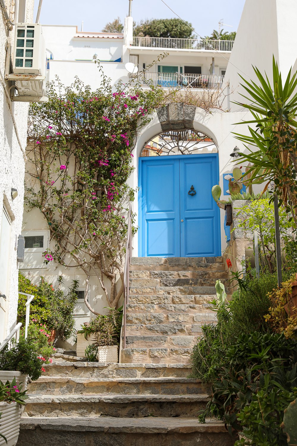 Stairway leading to a blue door in Sant'Angelo village in Ischia, Italy