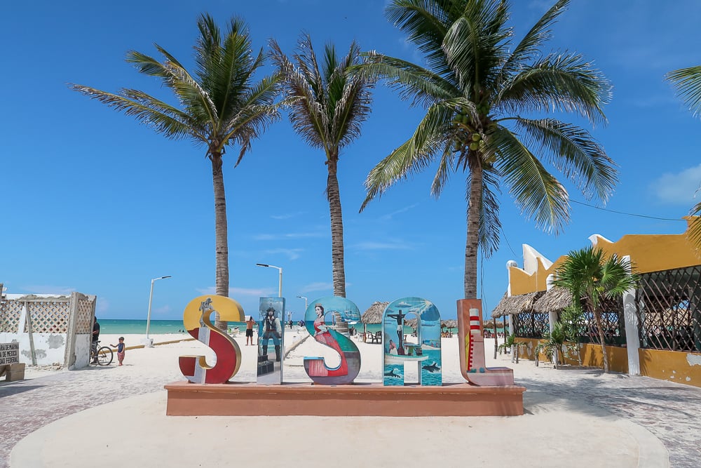 Colorful signage of Sisal by the beach