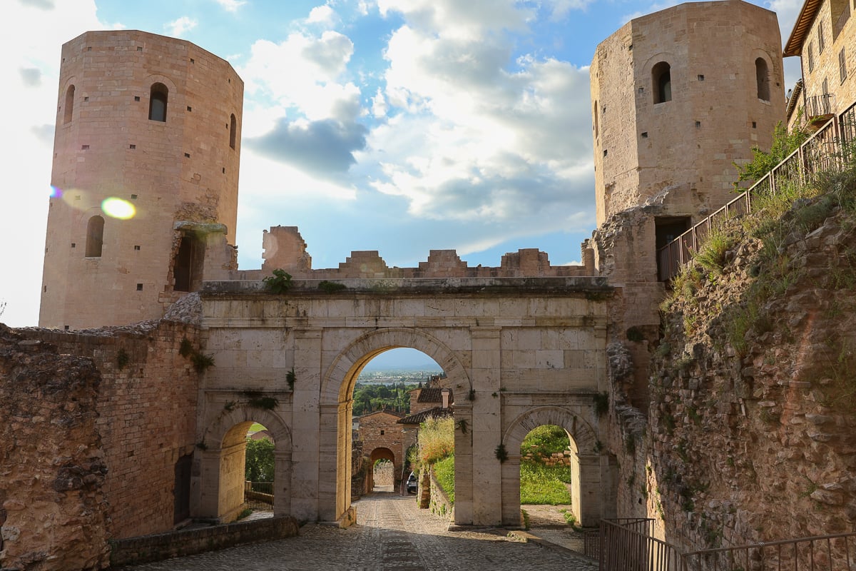 Porta Venere, an ancient gate with two towers and an arched entryway. A must-see in Spello, Italy