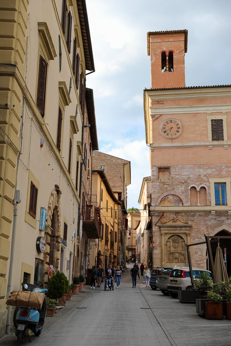 Narrow cobblestone street in Spello, Italy