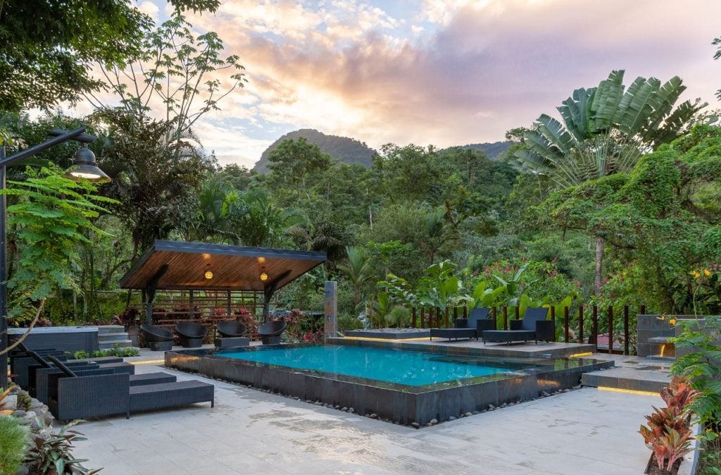 Pool area with lounge chairs at Tifakara. If you're wondering where to stay in La Fortuna, Tifakara Boutique Hotel is one of my most recommended hotels.
