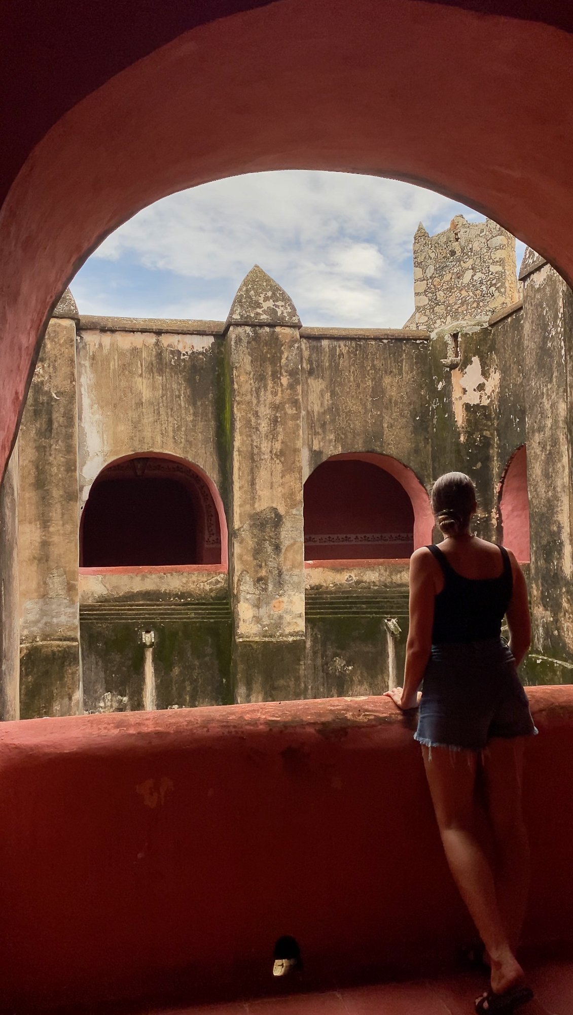 Maddy, blogger, standing on the corridor of San Bernardino Convent