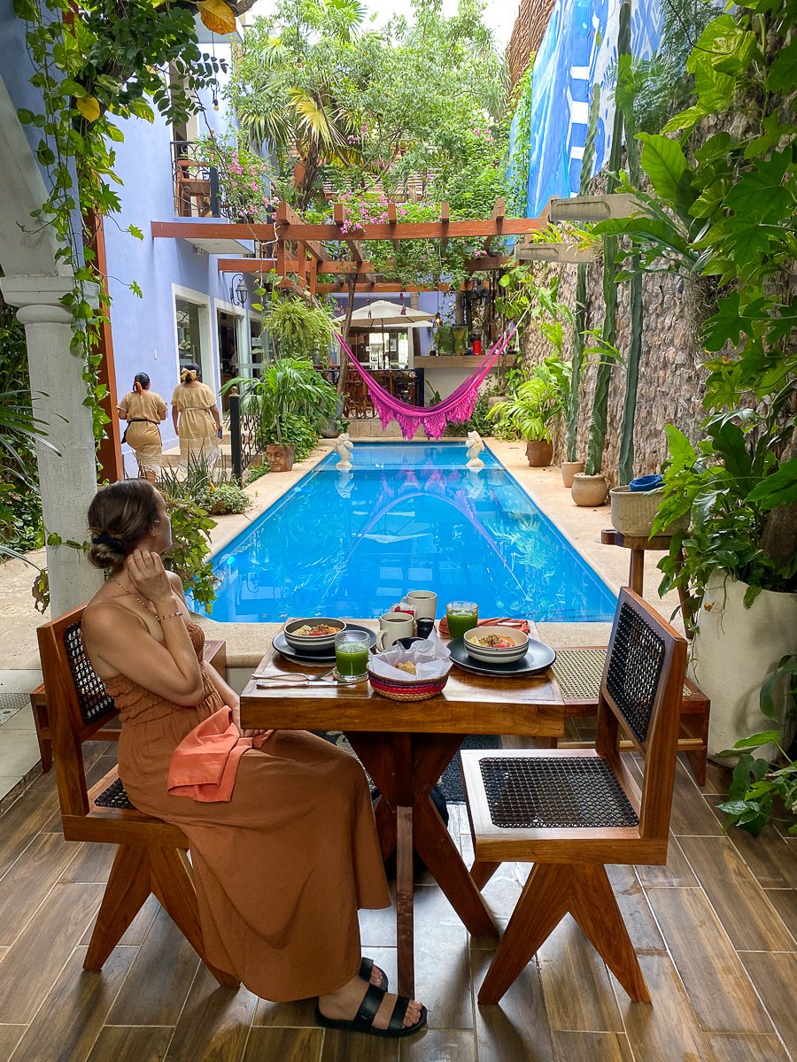 Maddy enjoying breakfast at Le Muuch Boutique Hotel, one of the best places to stay in Valladolid