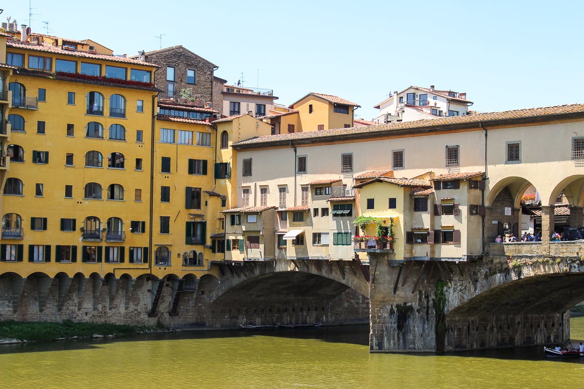 Buildings by the Vecchio Bridge in Florence. This is considered the oldest bridge in Florence so don't forget to include this in your Florence itinerary.