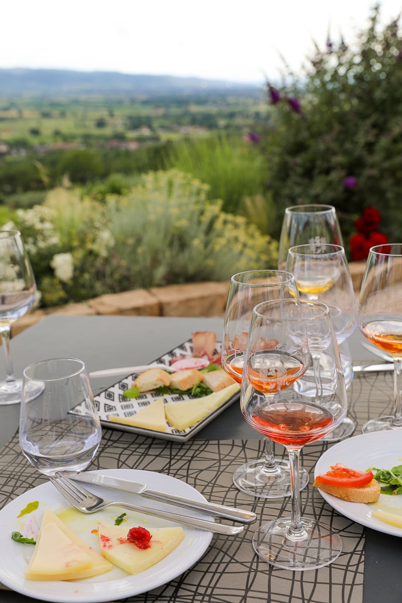 Glasses of wine with plates of cheese in a restaurant in Spello