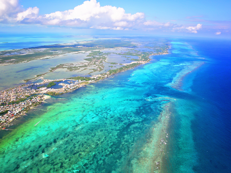 Aerial view of the beautiful azure and turquoise waters of Belize Barrier Reef