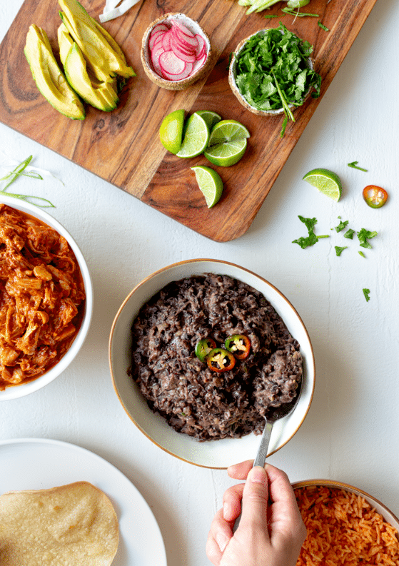 These easy refried black beans are packed with the flavors of garlic, onion, and jalapeño. The perfect addition to any Mexican-inspired meal!