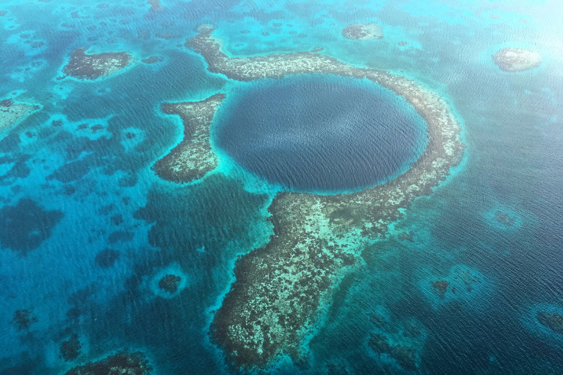 aerial view of the great blue hole in belize - one of the best things to do in Belize
