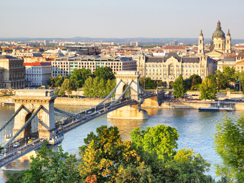 The Chain Bridge spanning the Danube River in Budapest with ornate architecture in the background