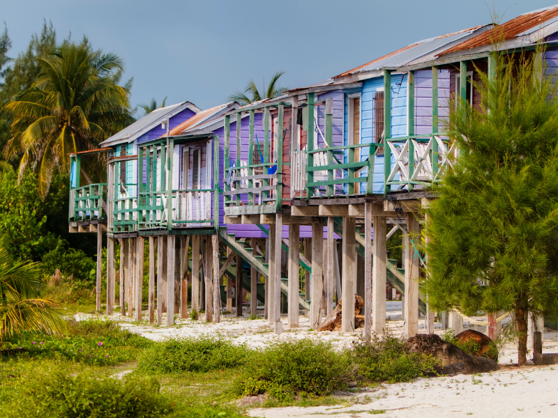 Colorful wooden stilted houses over the sand in Belize