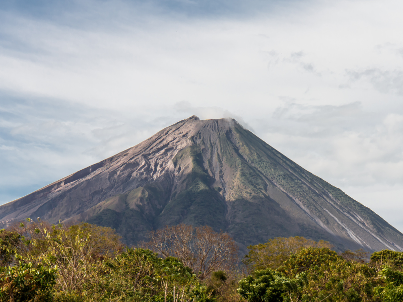 Concepcion Volcano in Nicaragua covered in greenery and clouds. The landscapes are far more beautiful in Nicaragua in rainy season