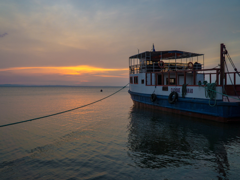 Ferry docked on the sea at sunrise