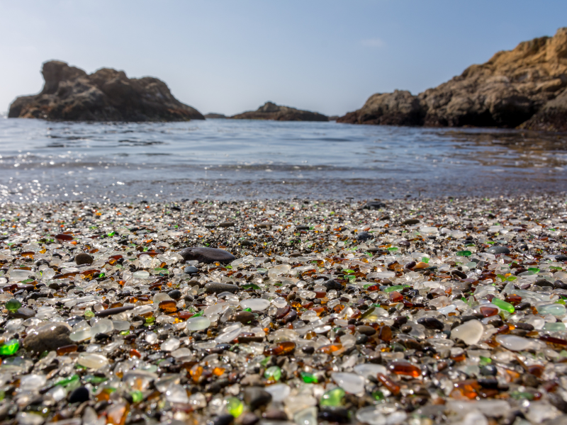 glass beach full of sea glass at fort bragg, california - one of the most beautiful and unique beaches in CA