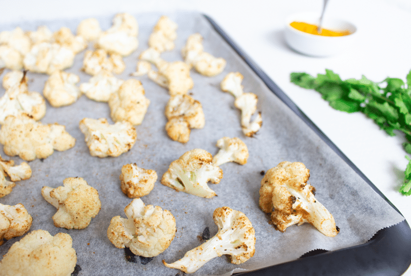 Roasted cauliflowers on a tray