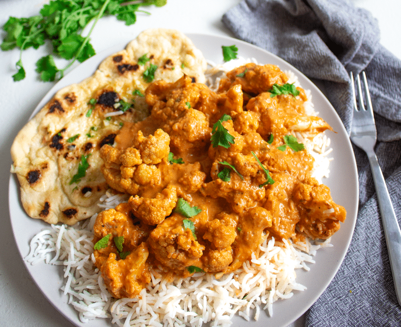 Cauliflower tikka masala on a plate with rice