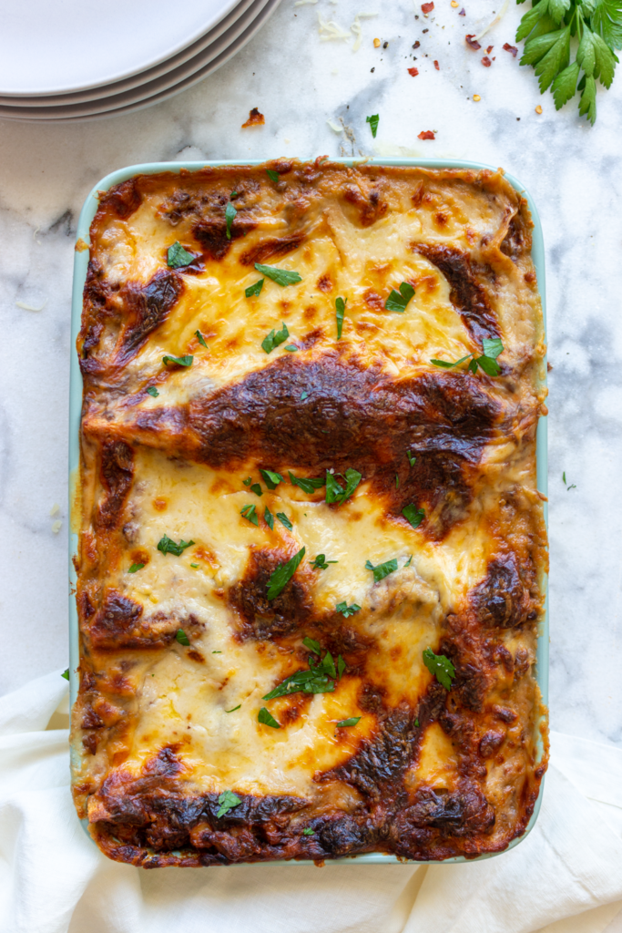 The best vegetarian lasagna recipe, layered with vegan bolognese sauce (with mushrooms, lentils & walnuts), a spinach-ricotta mixture, mozzarella cheese, and béchamel sauce!