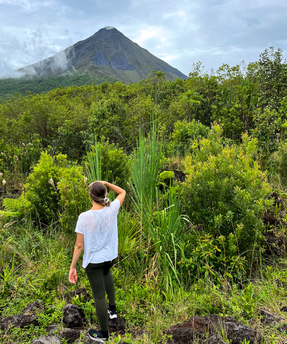 Maddy looking at Arenal Volcano from a distant trail